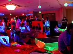Thumbnail of Image- Blacklight Fashion Show Audience - 2