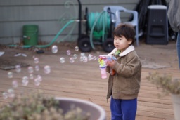 Thumbnail of Image- Alex & Bubble Gun - More Bubbles