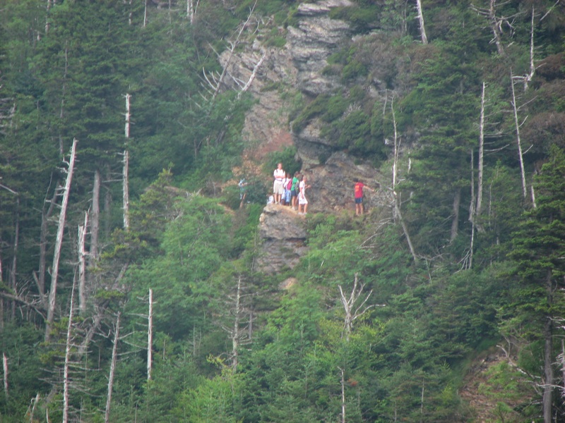 Distant Hikers - Below Cliff Top